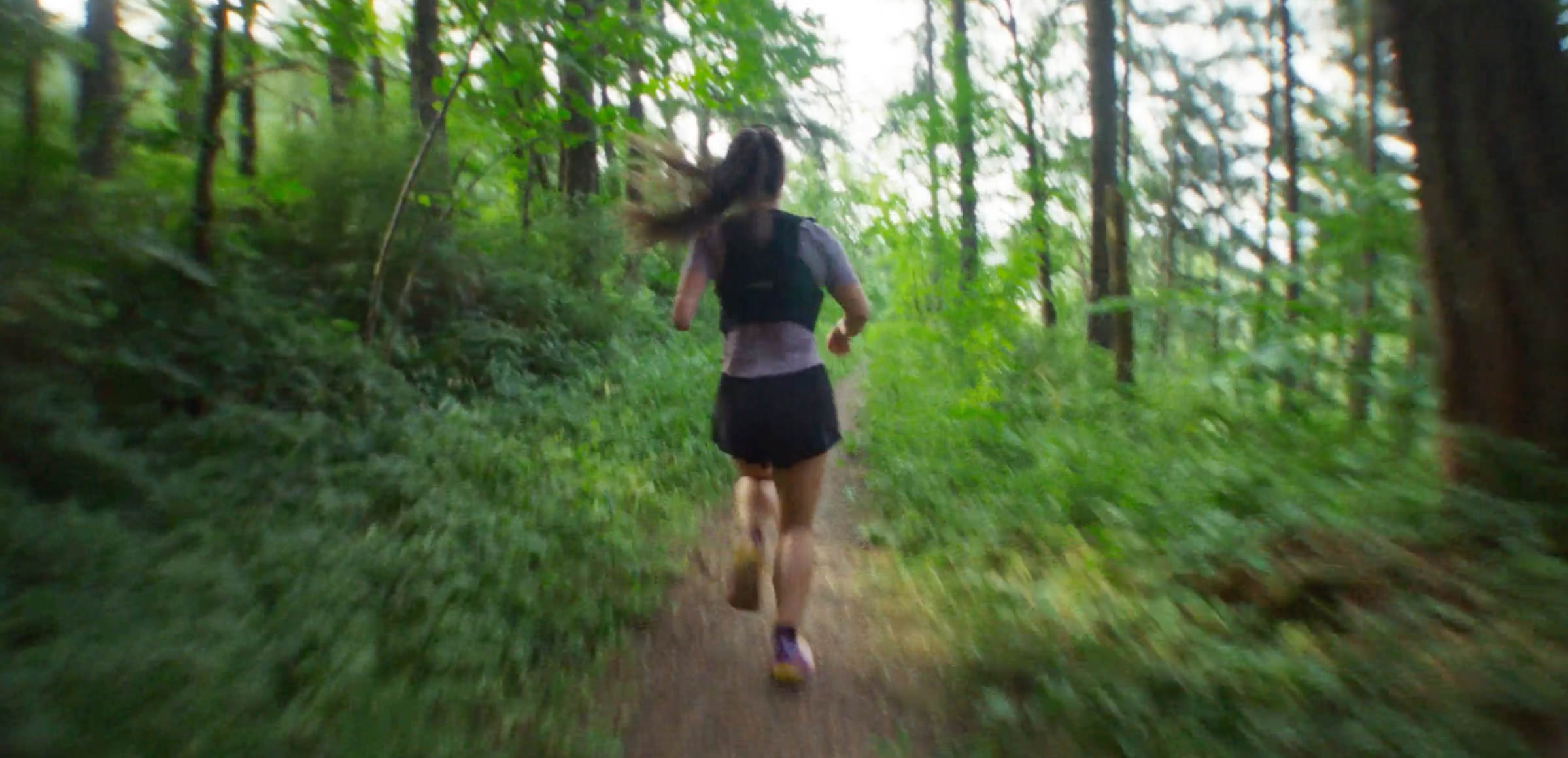 A runner on a forest trail